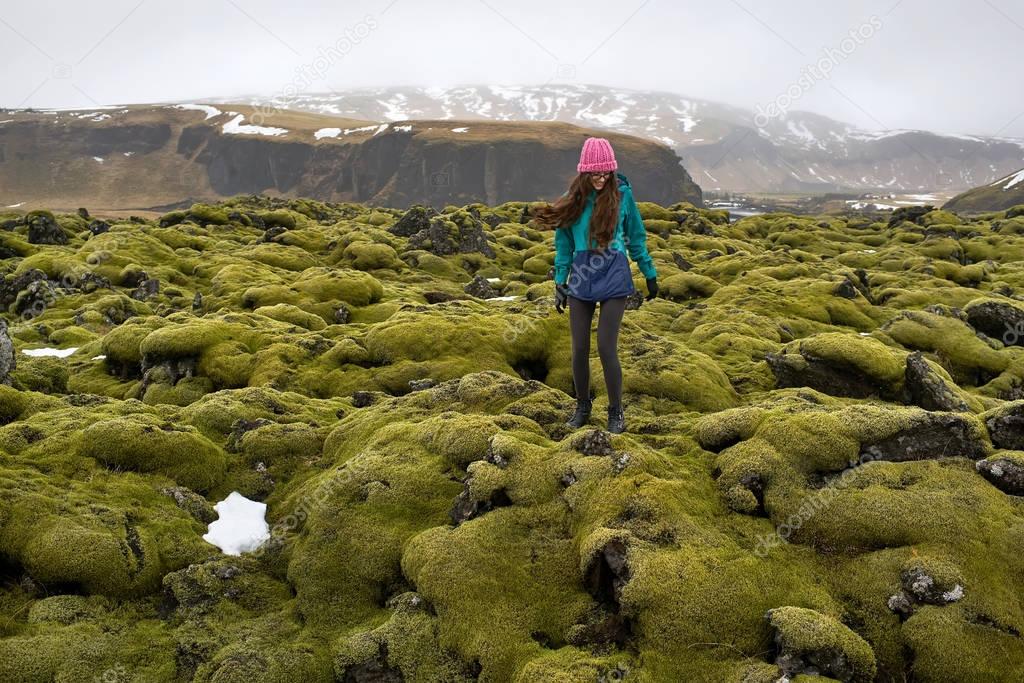 Girl posing on moss field