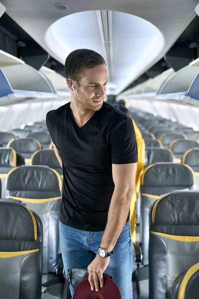 Handsome guy in airplane — Stock Photo, Image