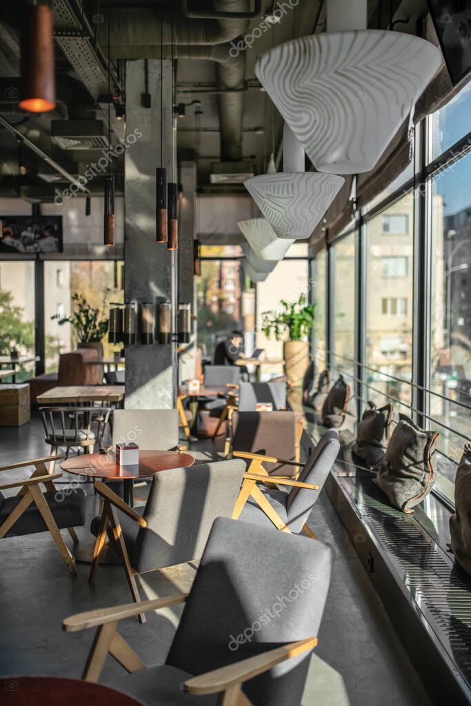 Interior of modern cafe in loft style — Stock Photo © bezikus #346269194 Interior of modern cafe in loft style