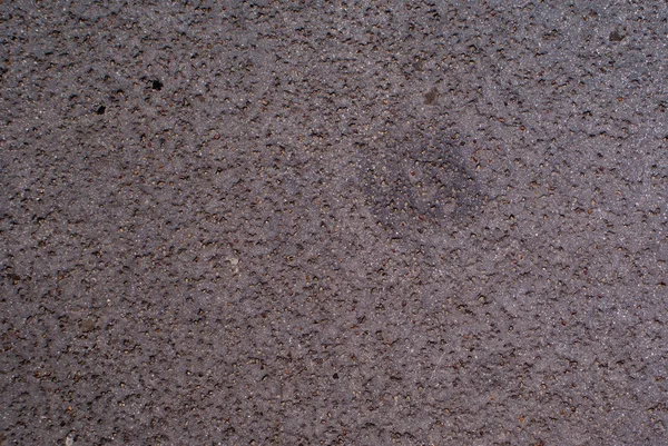 Textuur van asfaltweg met scheuren - abstracte achtergrond — Stockfoto