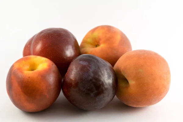 Plums and  peaches on a white background — Stock Photo, Image