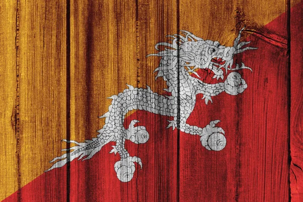Прапор Бутану намальовані на дерев'яні стіни для фону — стокове фото
