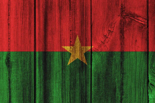 Vlajka Burkiny Faso namalované na dřevěné stěně obrazce na pozadí — Stock fotografie