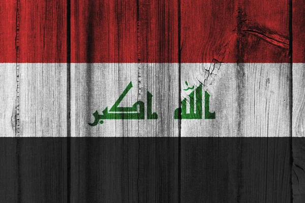 Irak vlag geschilderd op houten muur voor achtergrond — Stockfoto
