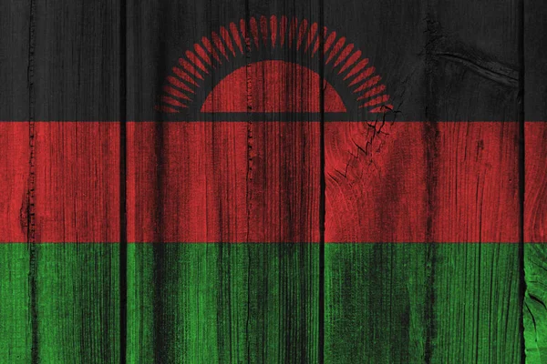 マラウイの国旗を背景に木製の壁に描かれました。 — ストック写真