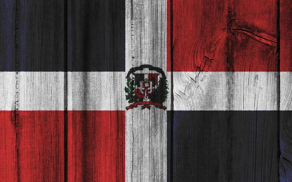 背景があるのため木製の壁に描かれたドミニカ共和国の国旗 — ストック写真