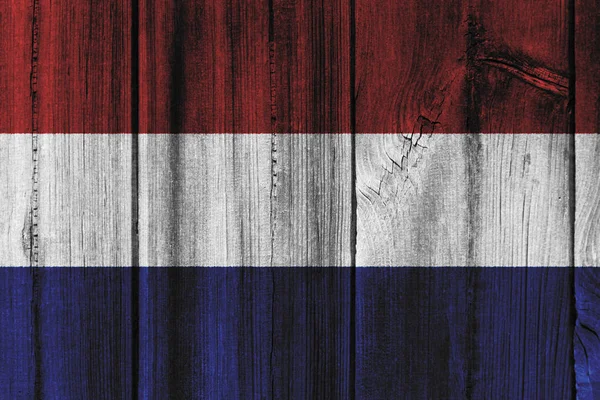 Флаг Нидерландов, раскрашенный на деревянной стене для фона — стоковое фото