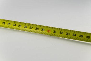 Ölçü birimi teyp, santimetre sarı. Ölçü aracı donanımları. Backgr