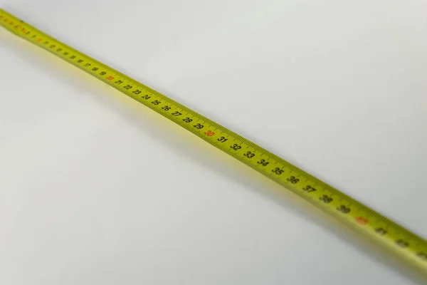 Páska žlutá opatření, centimetr. Zařízení pro měření nástroj. Pozadí — Stock fotografie
