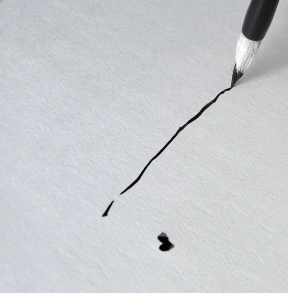 The line is drawn using black ink and a brush for calligraphy — Stockfoto