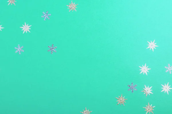 Beautiful festive mint background with silver stars.