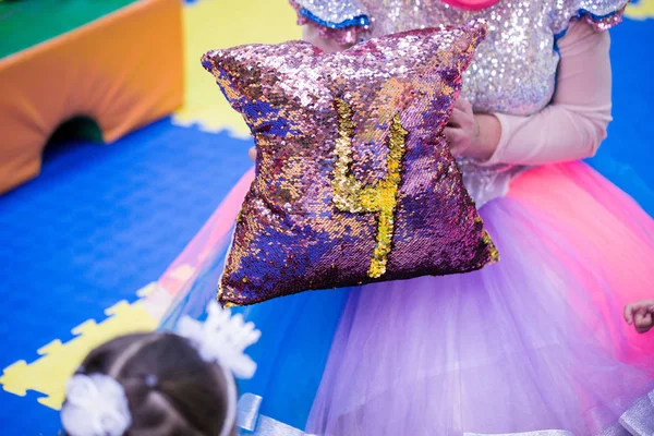 Pillow with shiny sequins, painted chicken 4, children's hands, holiday.