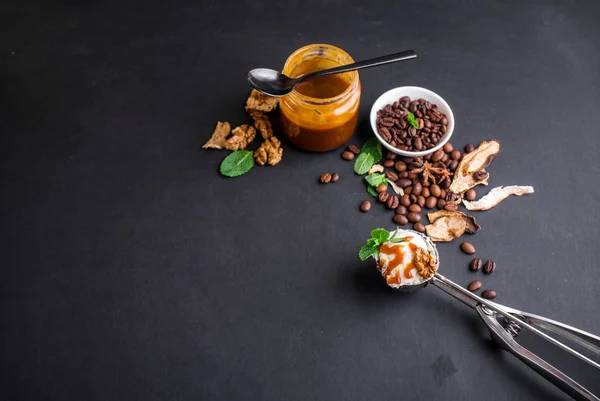 Mushroom Chaga Coffee Superfood Trend-dry and fresh mushrooms and coffee beans on dark background with mint.