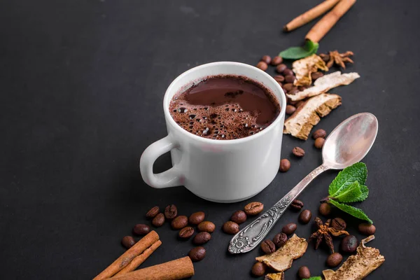 Mushroom Chaga Coffee Superfood Trend-dry and fresh mushrooms and coffee beans on dark background with mint. Coffee break