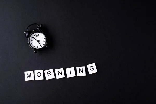 Black Alarm Clock Black Background Words Morning Abstract Content — Stock Photo, Image