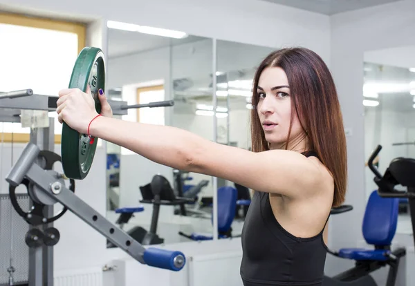 Girl is engaged in sports — Stock Photo, Image