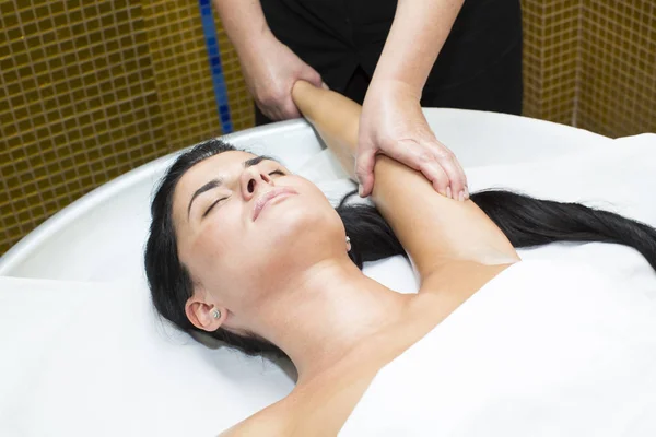 Young girl doing a massage — Stock Photo, Image