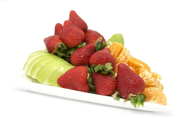 Large plate of sliced fruit — Stock Photo, Image