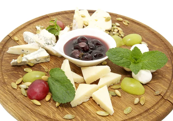 Cheese plate with several varieties of cheese — Stock Photo, Image