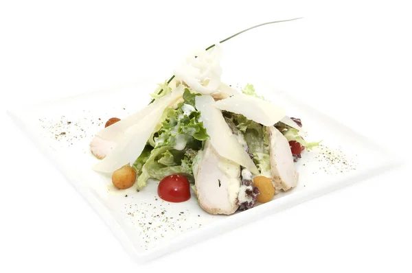 Caesar salad on a white plate — Stock Photo, Image