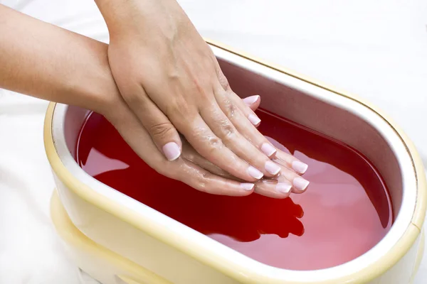 Process paraffin treatment of female hands — Stock Photo, Image