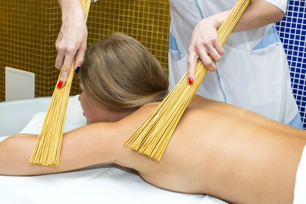 Massage with bamboo sticks — Stock Photo, Image