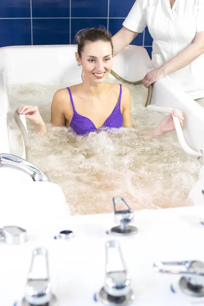 Woman during hydromassage in beauty salon — Stock Photo, Image