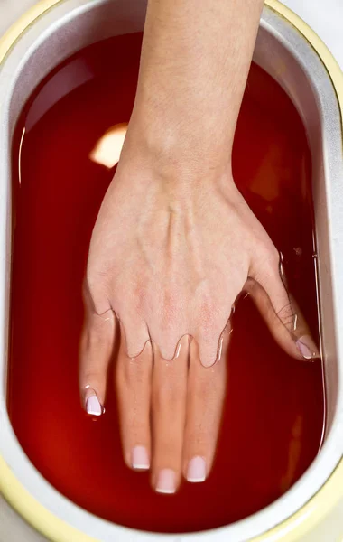 Process paraffin treatment of female hands — Stock Photo, Image