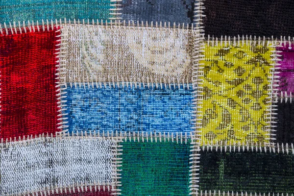 Texture di un pezzo di tappeto vecchio per — Foto Stock