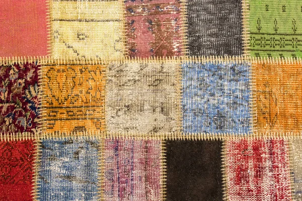 Textur eines Stücks alten Teppichs, um — Stockfoto