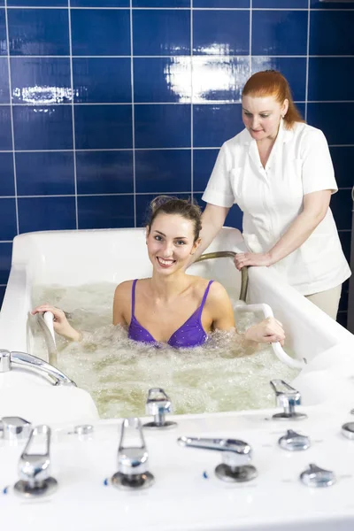 Woman during hydromassage in beauty salon — Stock Photo, Image