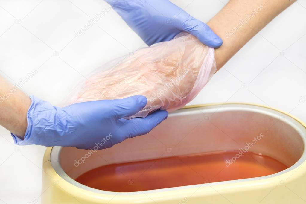 Process paraffin treatment of female hands