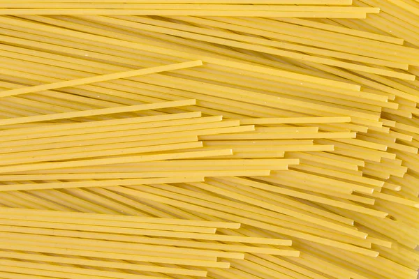 Textura de fundo de massa espaguete cru — Fotografia de Stock