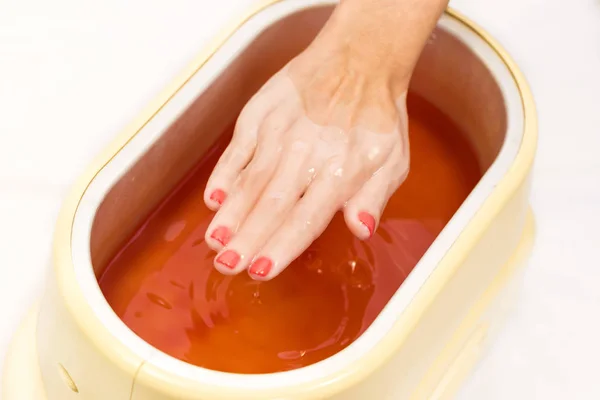 Process paraffin treatment of female hands — Stock Photo, Image