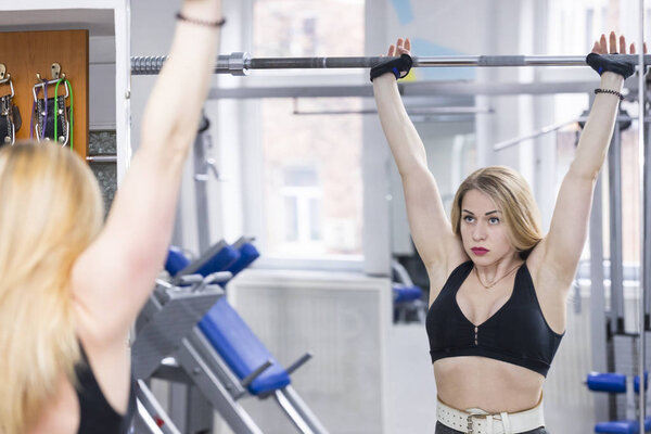 girl is engaged in power fitness in the gym 