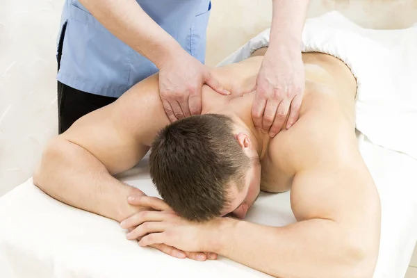 Man doing sports massage — Stock Photo, Image