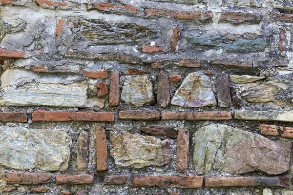 Fondo de una antigua pared de ladrillo de piedra —  Fotos de Stock
