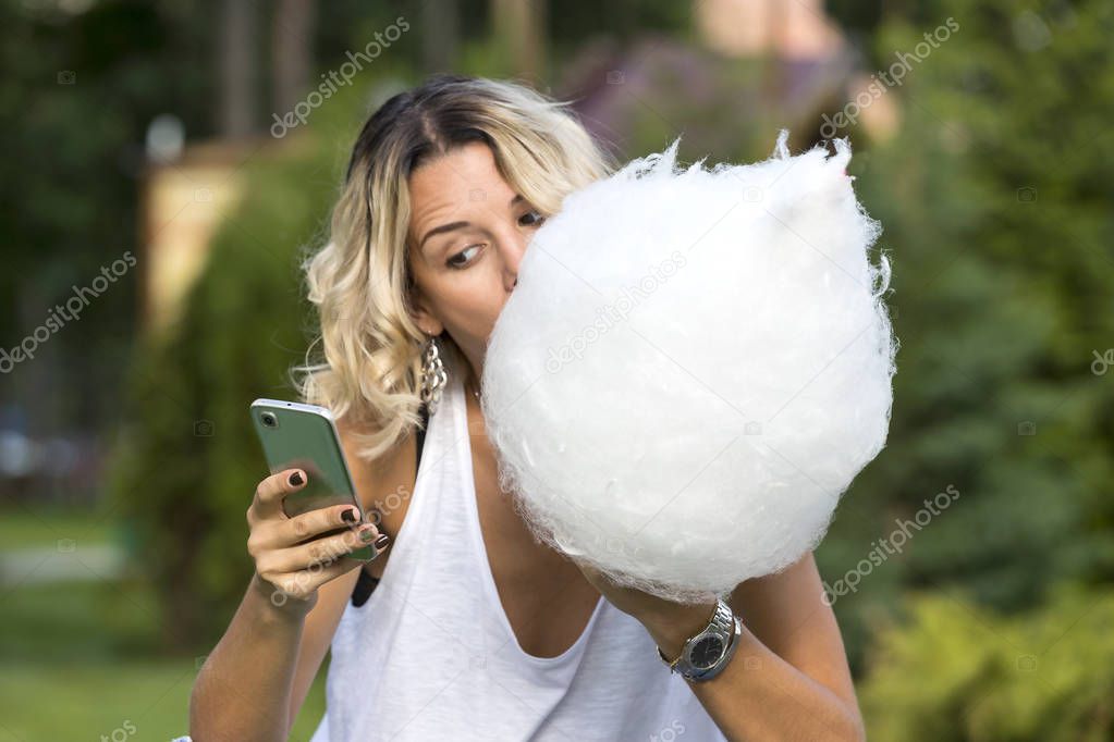 Girl eating sweet cotton candy