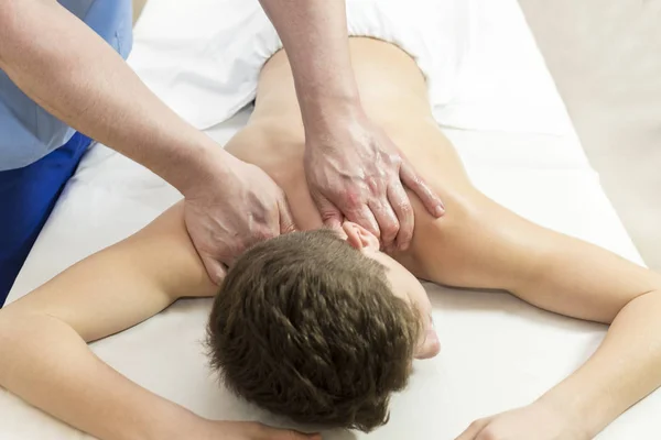 Young man  wellness treatments sports massage — Stock Photo, Image