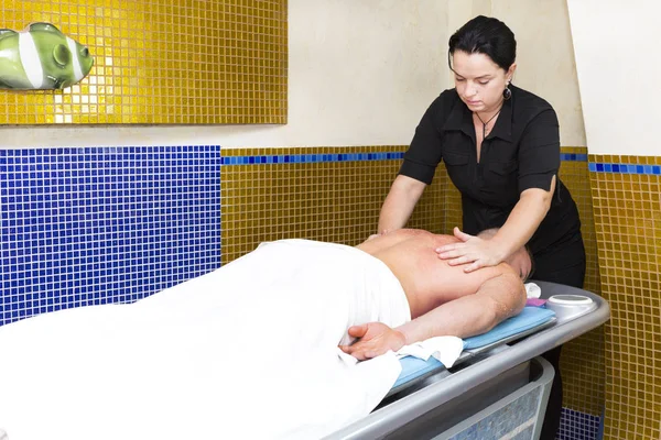 The process of sports massage is done by a man — Stock Photo, Image