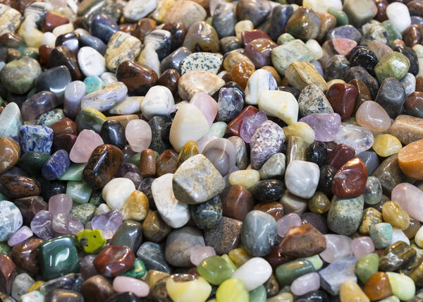 Background of colored stones of ordinary and semi-precious