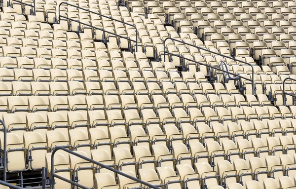 Rows of plastic chairs for spectators in the stands