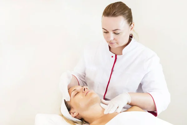 Process cosmetic mask of massage and facials in beauty salon