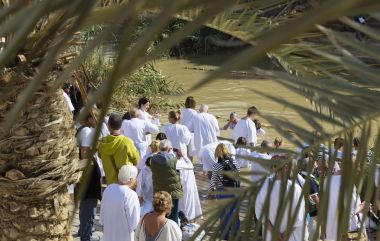 BETHABARA, ISRAEL- 25 NOVEMBER 2017: Pilgrims from different countries accept the rite of baptism in the Jordan River in Israel clipart