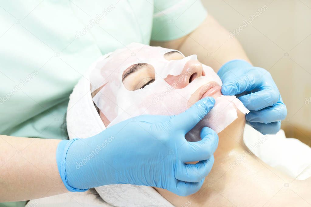 Process cosmetic mask of massage and facials in beauty salon