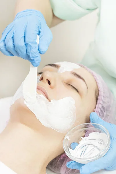 Massage and facial peels at the salon using cosmetics