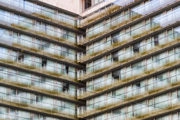 The background of the window of a multi-storey building is shot closeup.