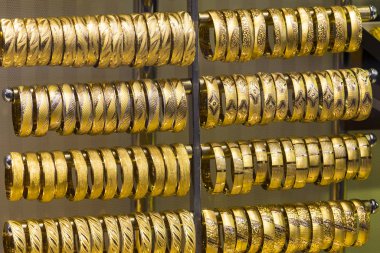 Traditional turkish gold oriental bracelets for women orient background.