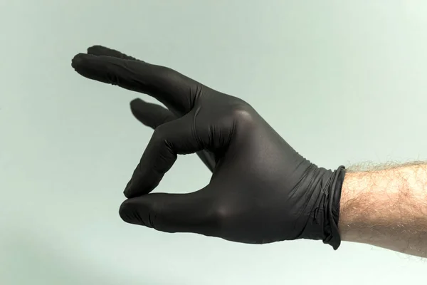 Ручные Жесты Сером Фоне Стерильной Резиновой Перчатке Большим Ланом — стоковое фото
