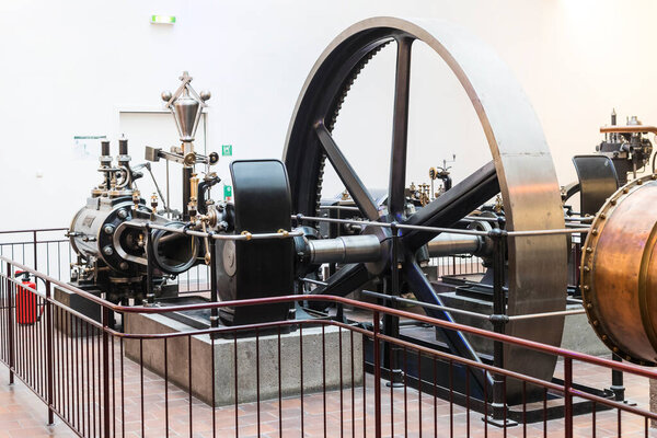 MUNICH, GERMANY - NOVEMBER 26, 2018 : The German Museum of Science and Technology Achievement represents the exposure of old mechanisms for the production of energy steam engines, windmills, electric generators. 